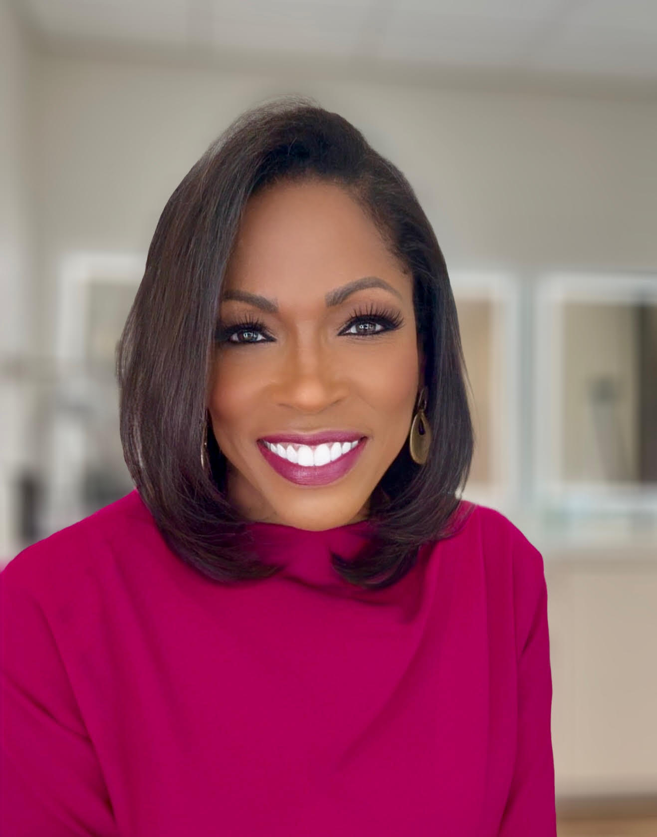 Shawn Yancy, news anchor and founder, in a warm studio portrait.